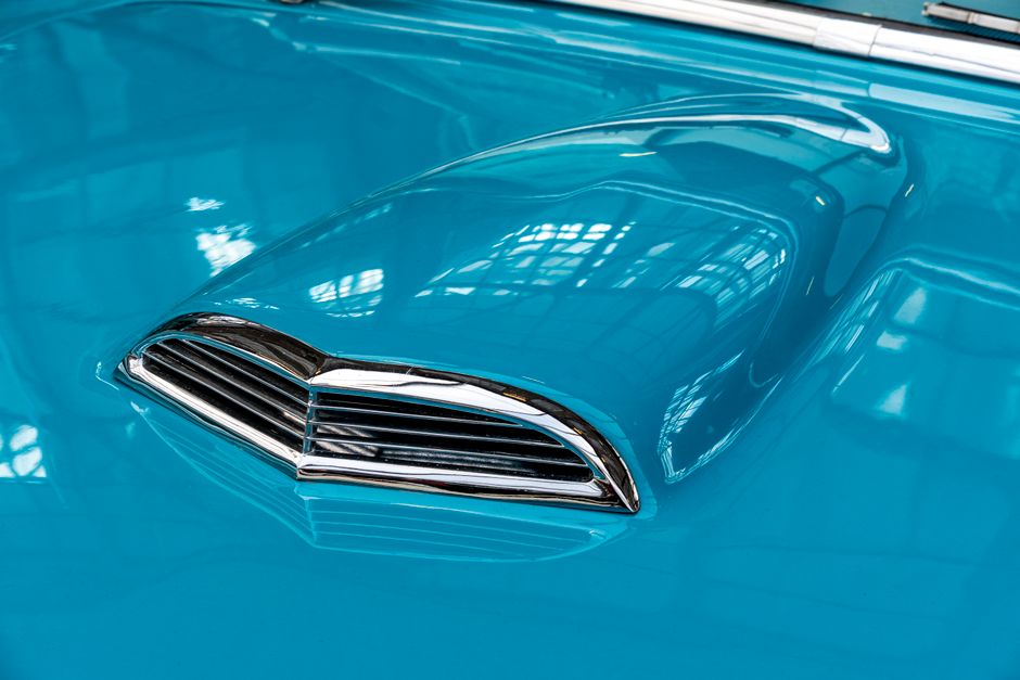 Glossy car paint with clear reflections after detailing